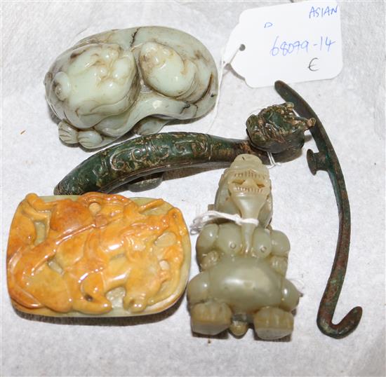 Chinese celadon & black jade group of a lion dog and pup,  another and belt buckle etc